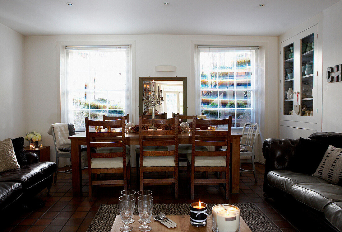 Dining table and chairs with sofas in Grade II listed Georgian townhouse in London