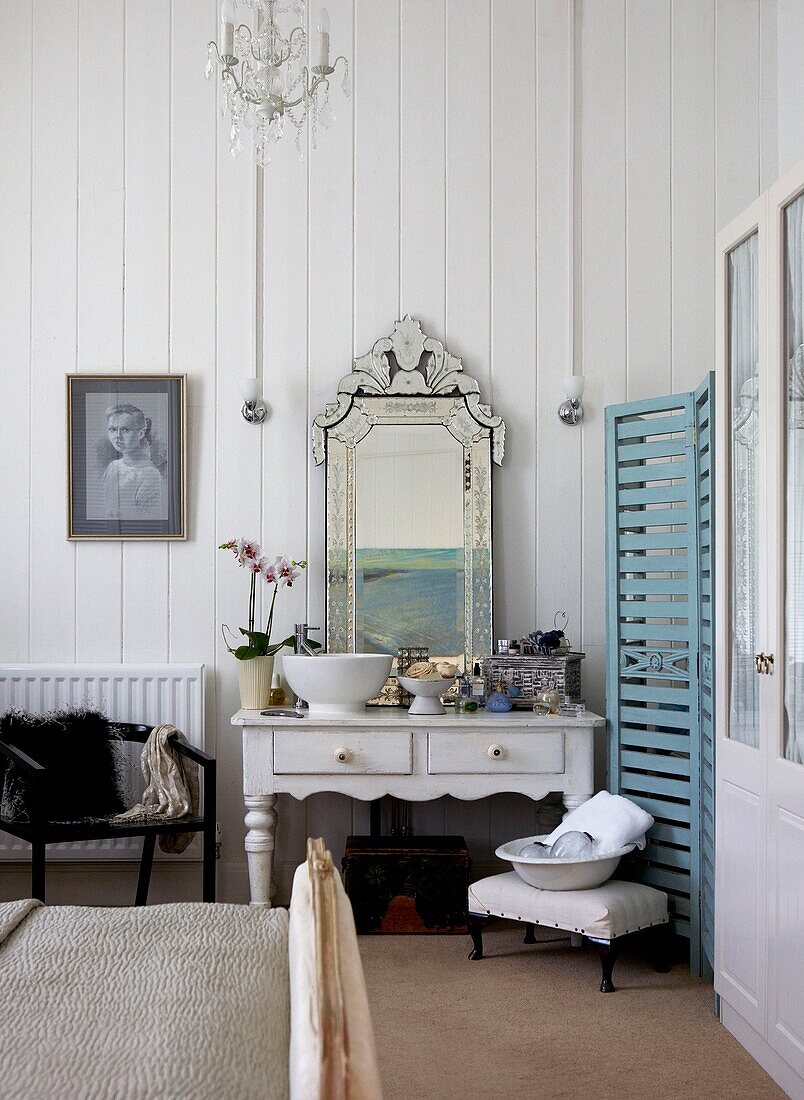 Panelled bedroom and washstand unit in Edwardian school house conversion