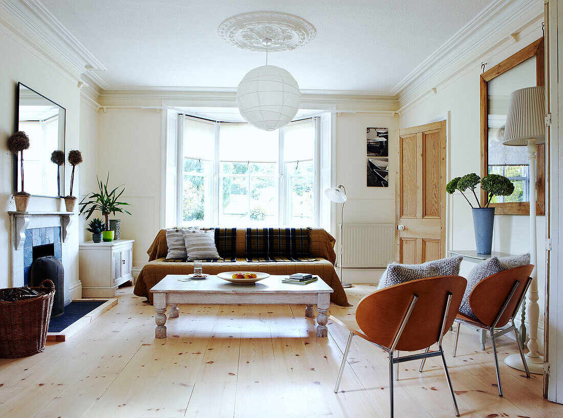 Sunlit living room with uncarpeted floor