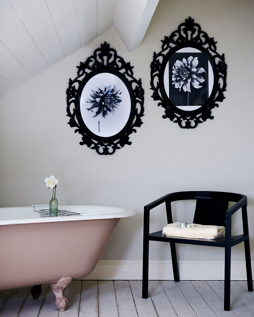 Attic bathroom with metal picture frames and slanted ceiling