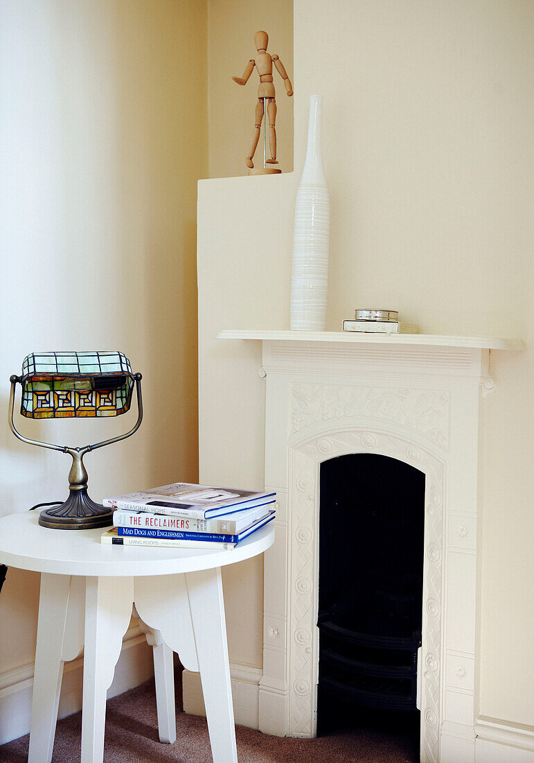 Antique lamp with books with original fireplace