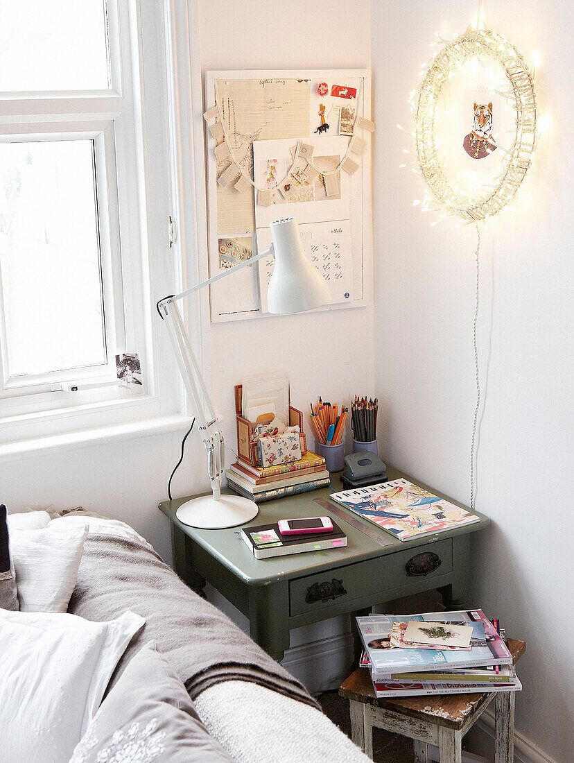 Deskspace with noticeboard in corner of room in Hastings home, East Sussex, UK