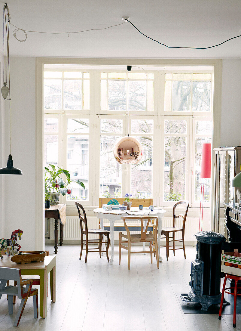 View through playroom to dining area in contemporary apartment, Amsterdam, Netherlands