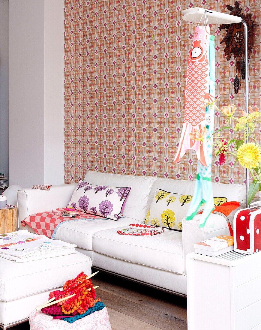 White leather sofa and ottoman in living room of family home, Mattenbiesstraat, Netherlands