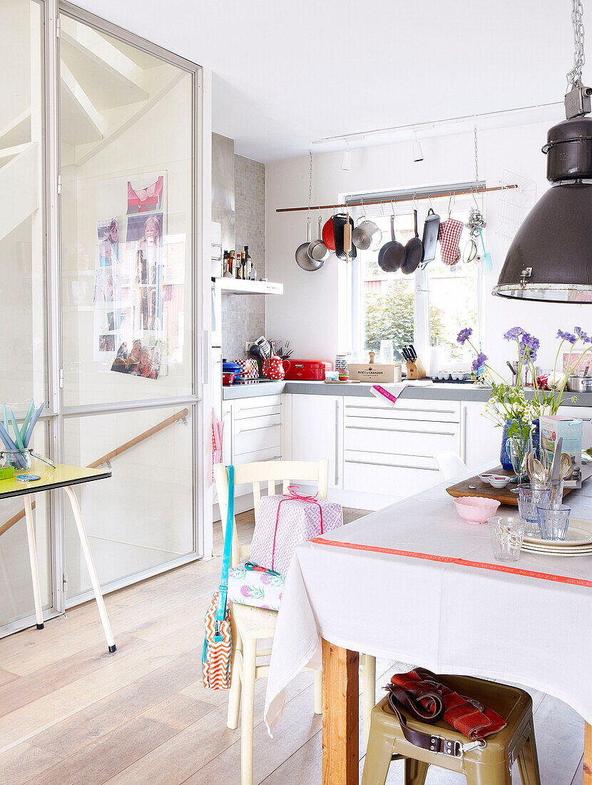 Sunlit kitchen with pans hanging at window, Mattenbiesstraat, Netherlands