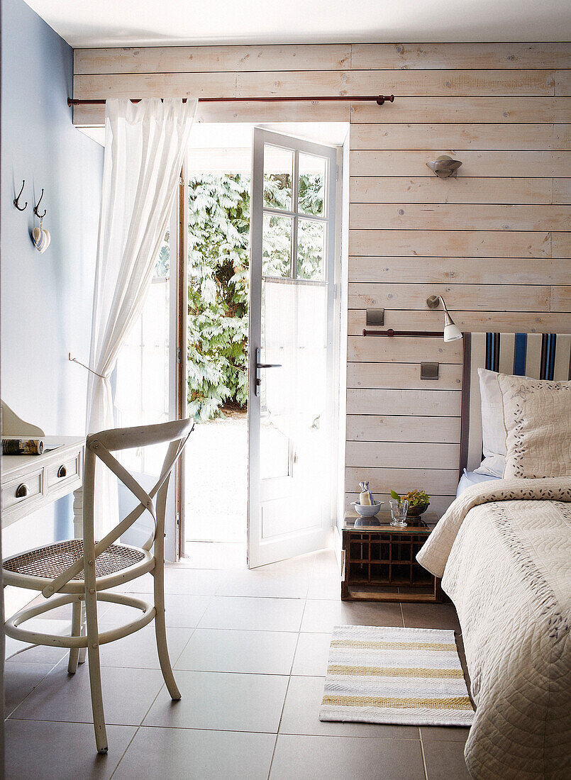 Open door to sunlit bedroom in Brittany guesthouse France