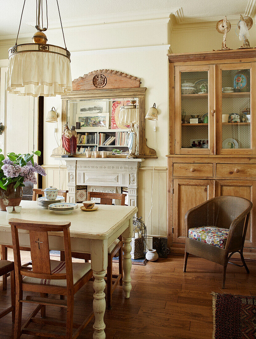 Dining room with glass-fronted dressed in Whitley Bay home Tyne and Wear England UK