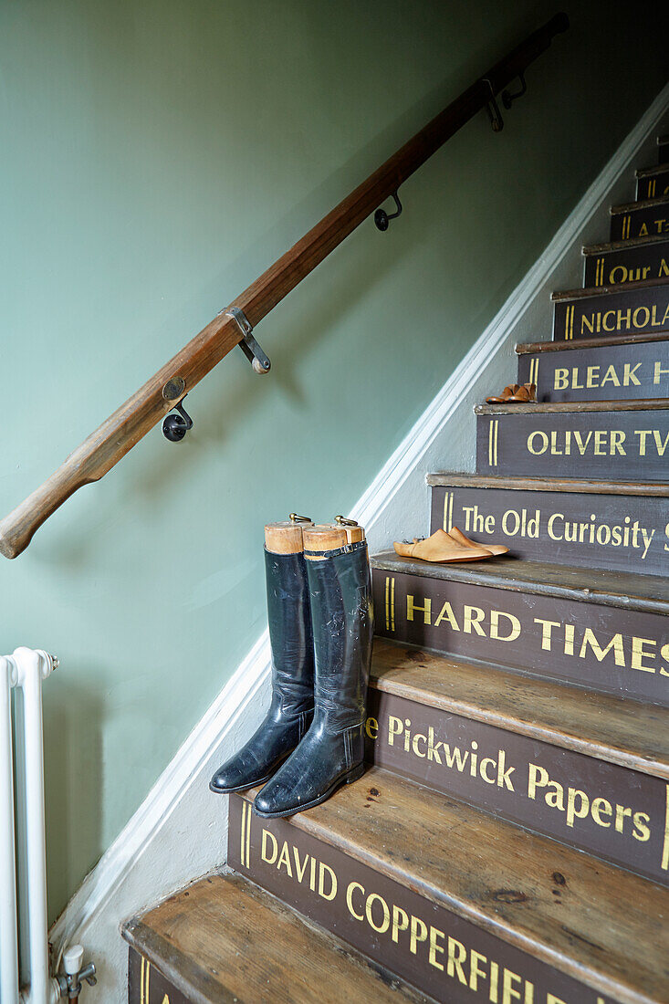 Vintage boots on staircase with banister in Sunderland home Tyne and Wear England UK
