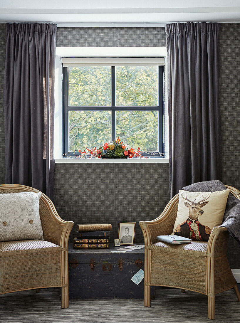 Pair of armchairs at window in 19th Century Grain Mill conversion, Scottish Borders, UK