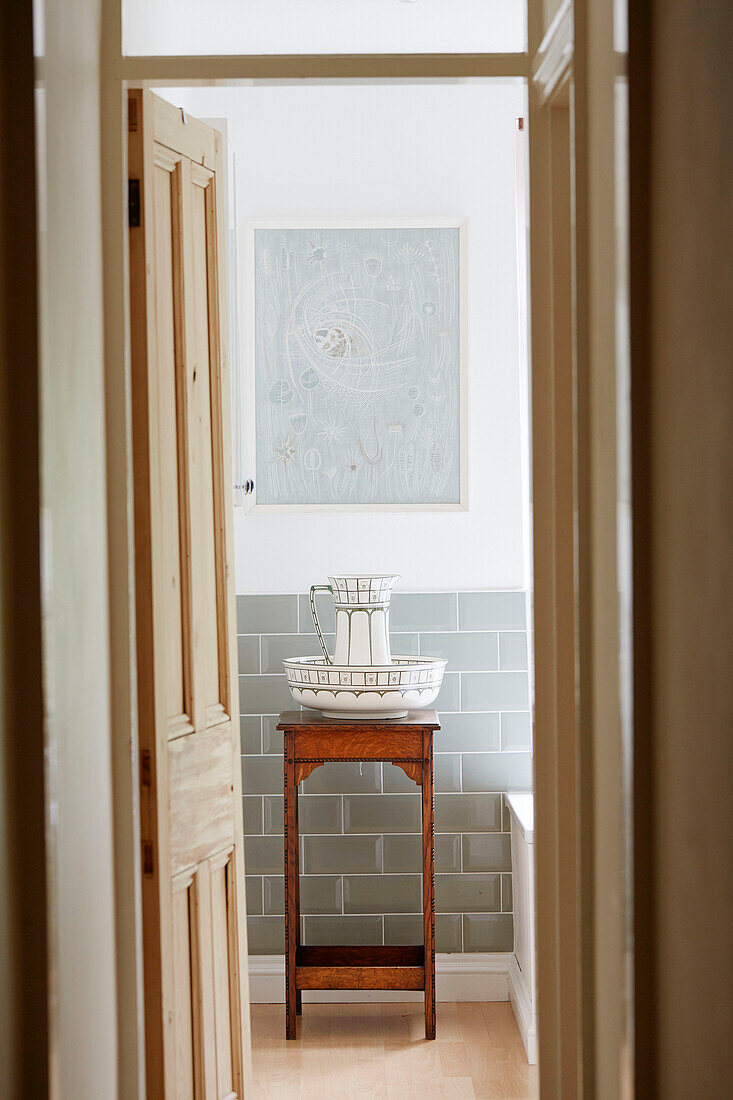 Jug and bowl on wooden washstand in Birmingham home England UK