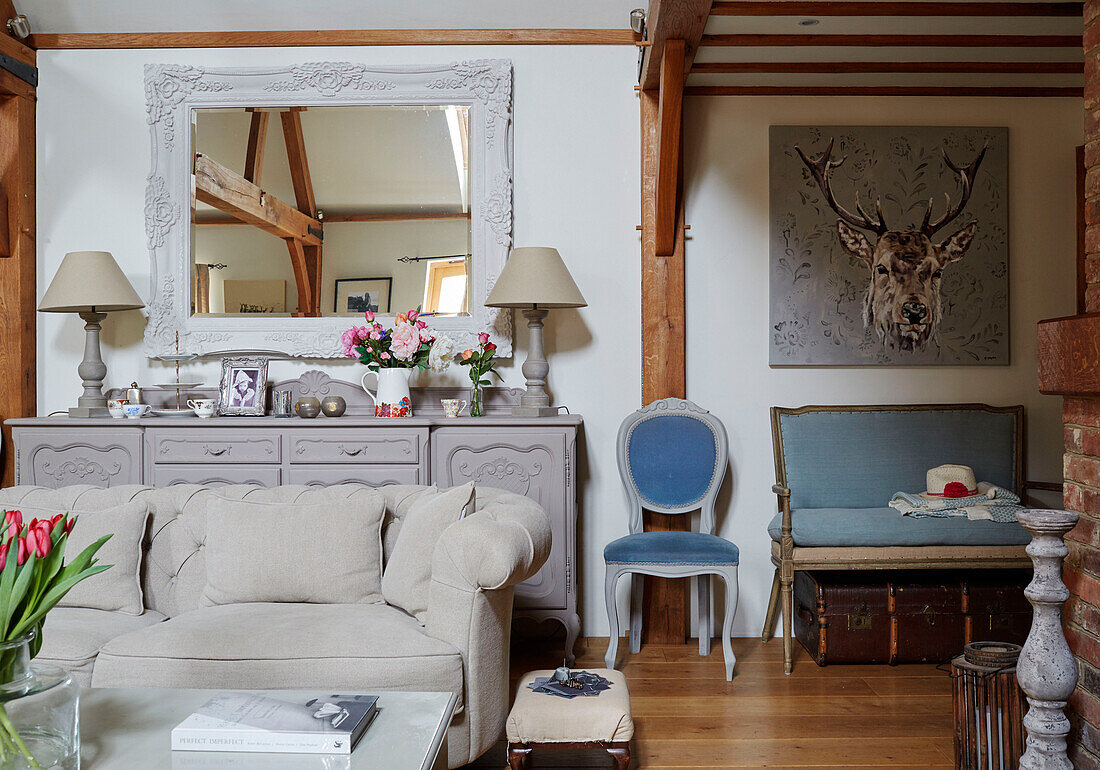 Upcycled sideboard with sofa and canvas of stag in Kent home, North East England, UK