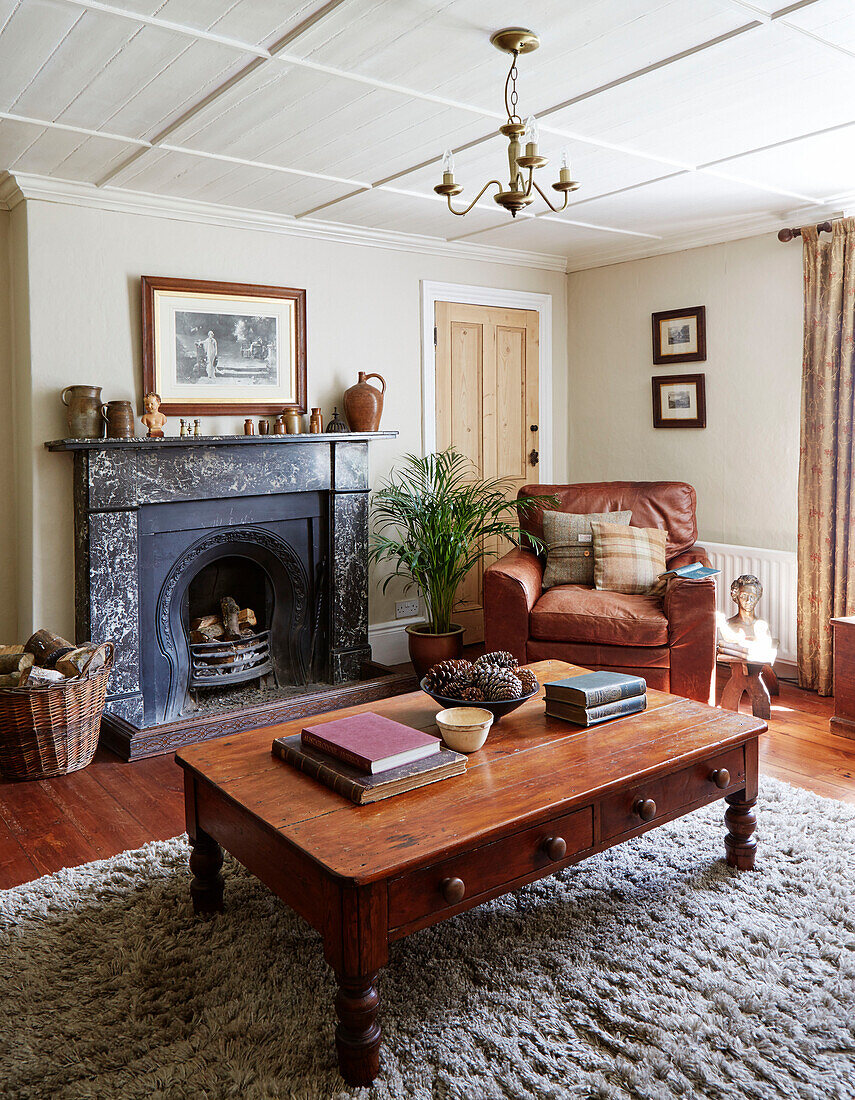 Books on low wooden coffee table in Northumberland living room, Tyne and Wear, England, UK