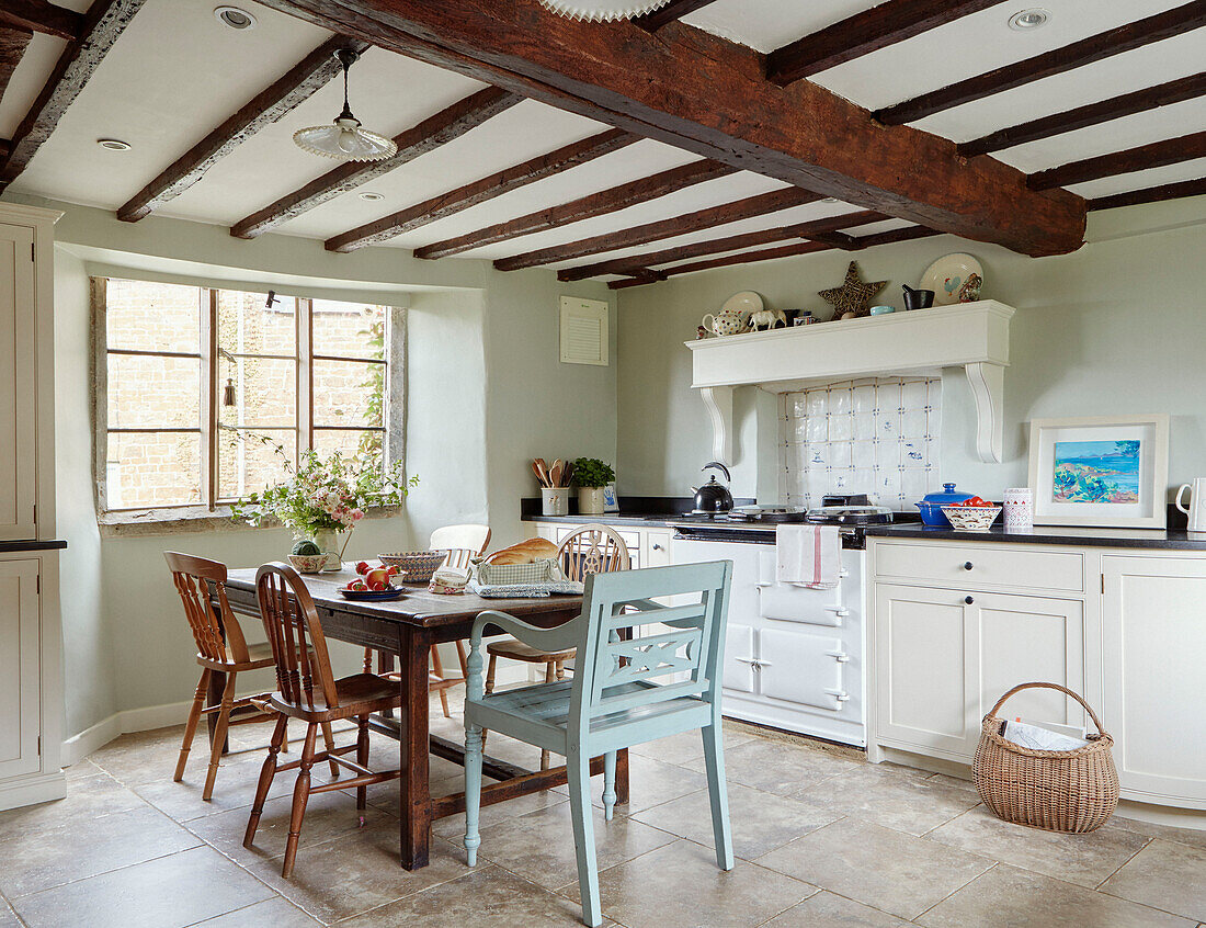 Beamed Oxfordshire kitchen with table and chairs, England, UK