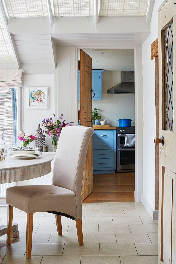 Dining chair at table in Berkshire cottage, England, UK