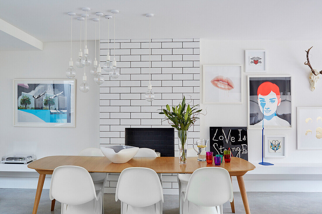 Bold prints and ceramic tiles with oak table and classic chair South East London, UK