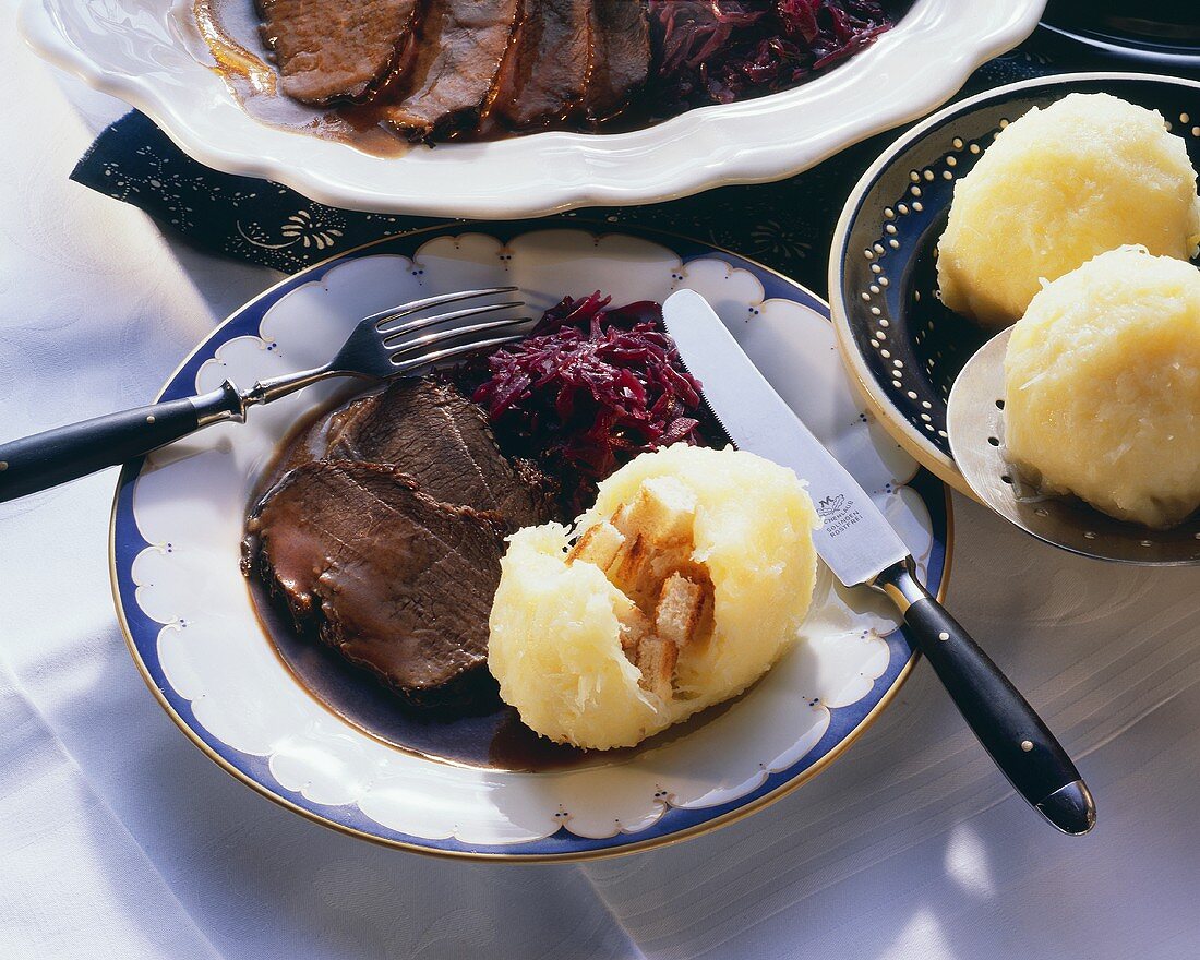 Roast beef with Thuringian dumplings & red cabbage on plate