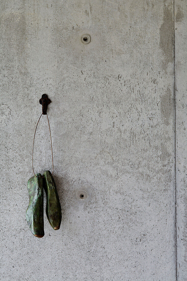 Pair of shoes hanging from a wall hook in Sligo home, Ireland