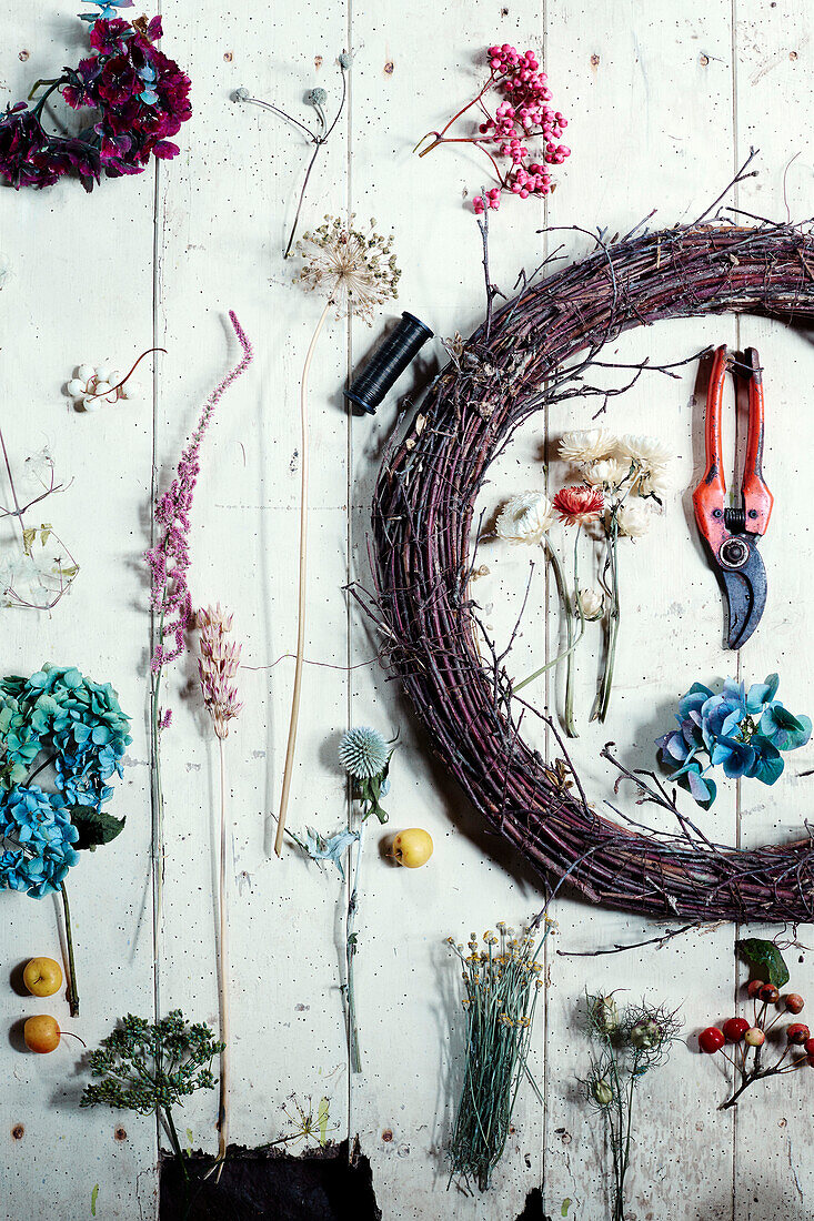 Cut flowers and tools for making a floral wreath in Radnorshire-Herefordshire borders, UK