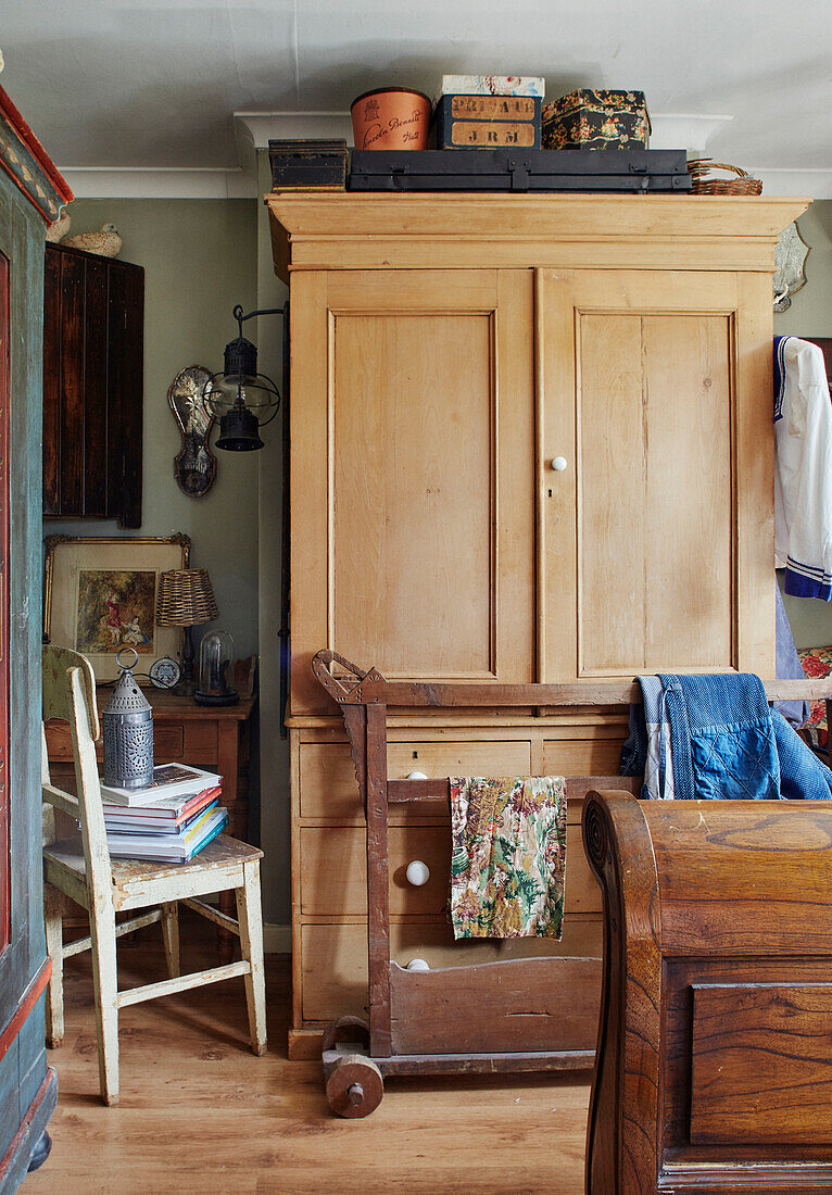 Antique clothes rail and wardrobe in Somerset bedroom, UK