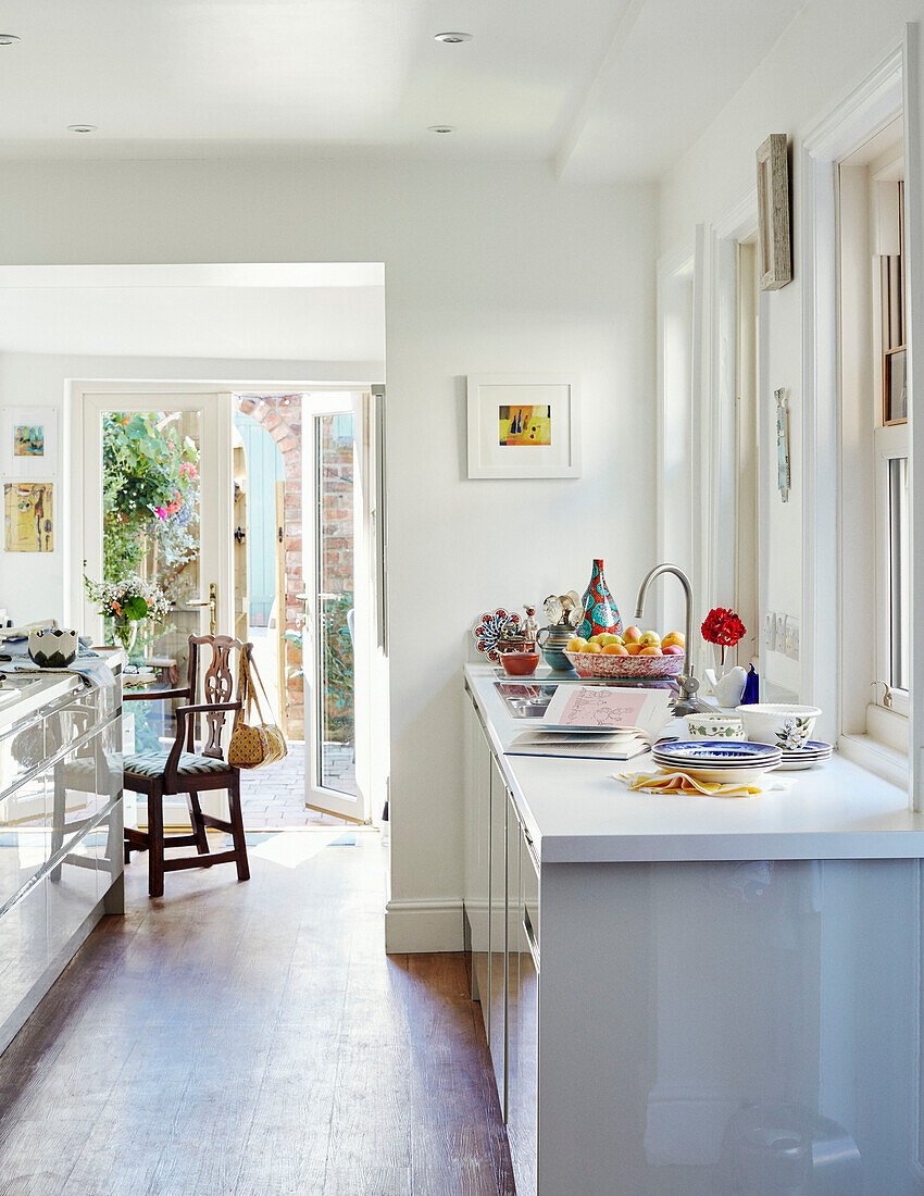 White sunlit kitchen in Northern home, UK