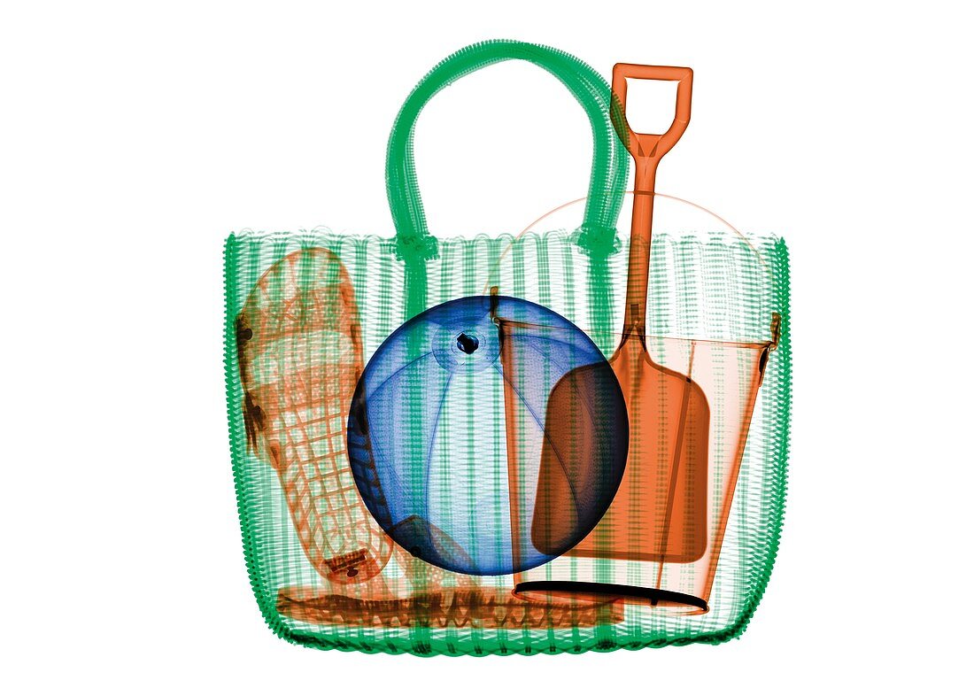 Woven beach bag with beach toys and sandals, X-ray