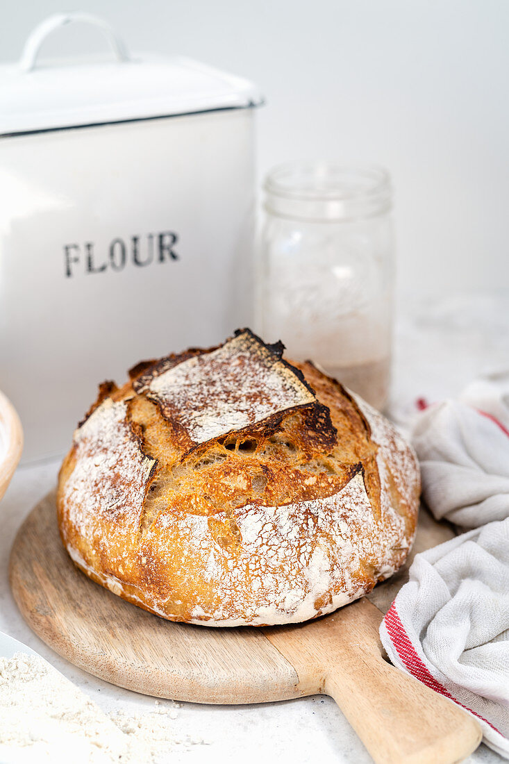 Loaf of sourdough bread on a bread board