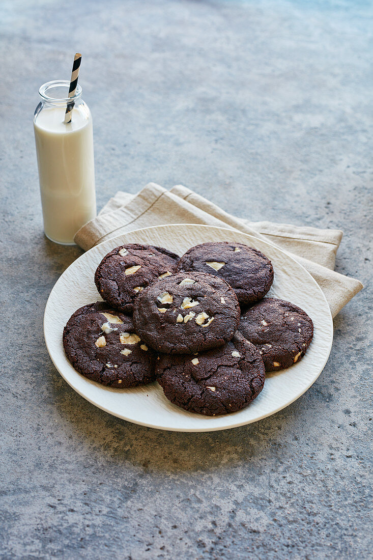 Chocolate cookies and a bottle of milk