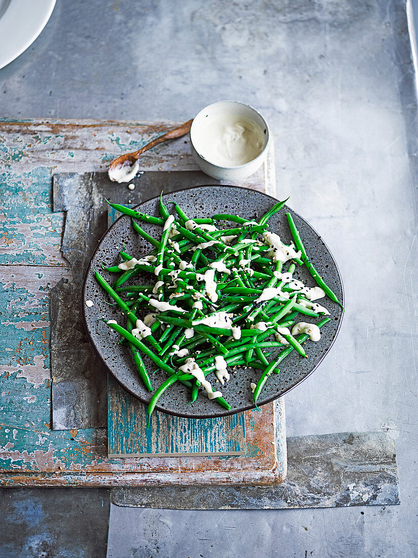Green beans with confit garlic and tahini dressing