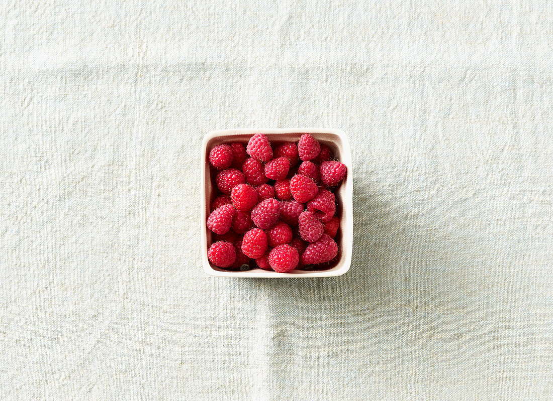 A punnet of fresh raspberries