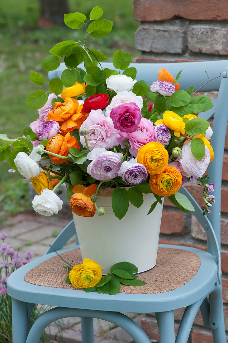 Colorful bouquet of buttercups and twigs