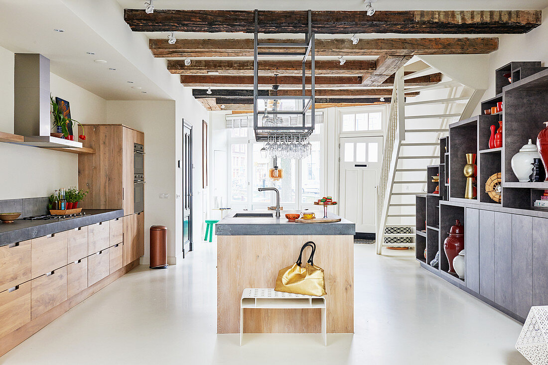 Custom kitchen with island counter in open-plan interior