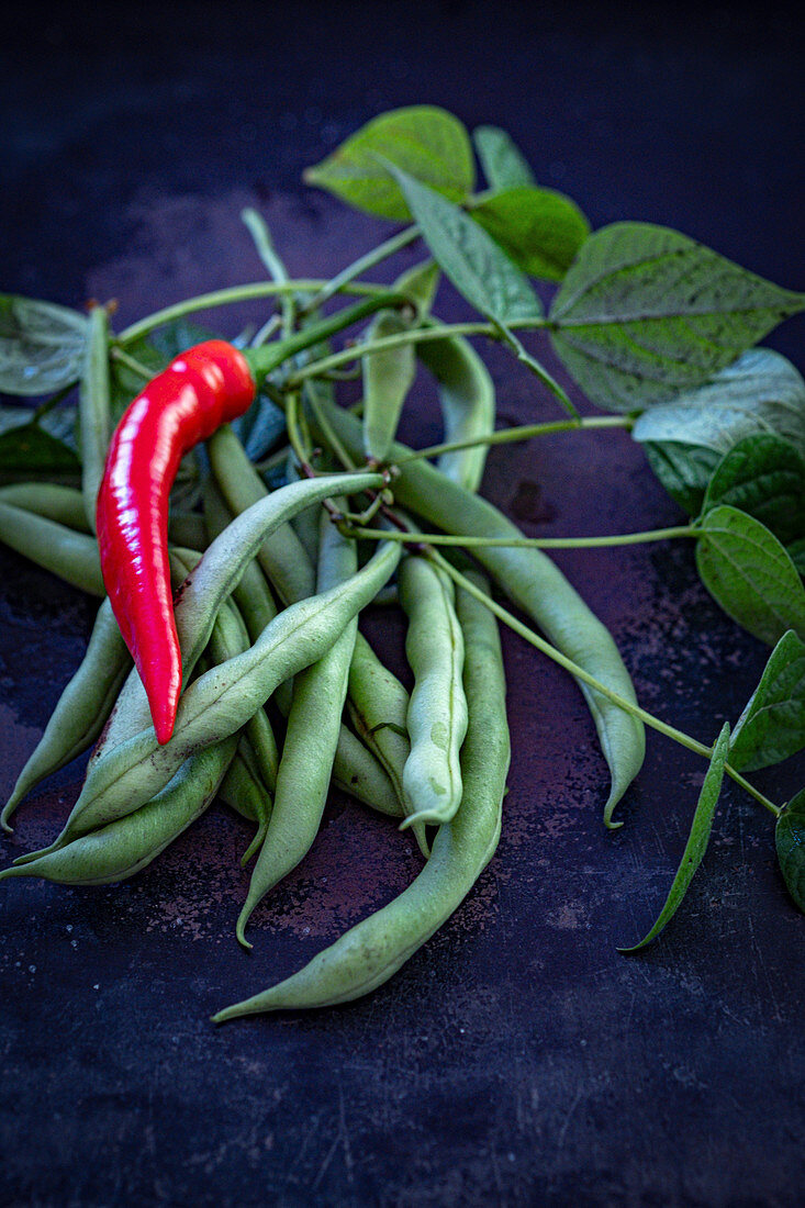 Green runner beans and red chilli peppers