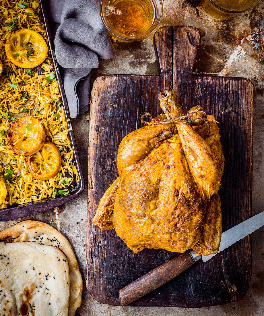Roast chicken with spiced masala butter and lemon rice