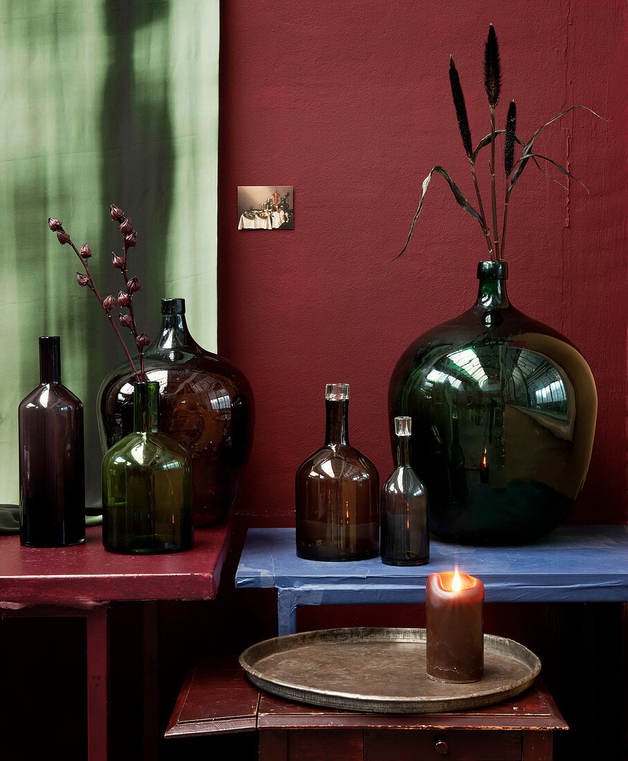 Arrangement of glass bottles of various colours