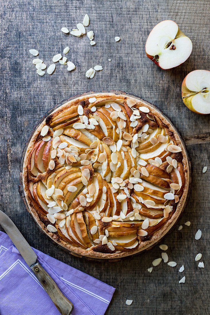 Apple and frangipane tart with almond flakes