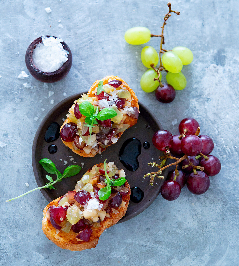Bruschetta with grapes, nuts and balsamic vinegar