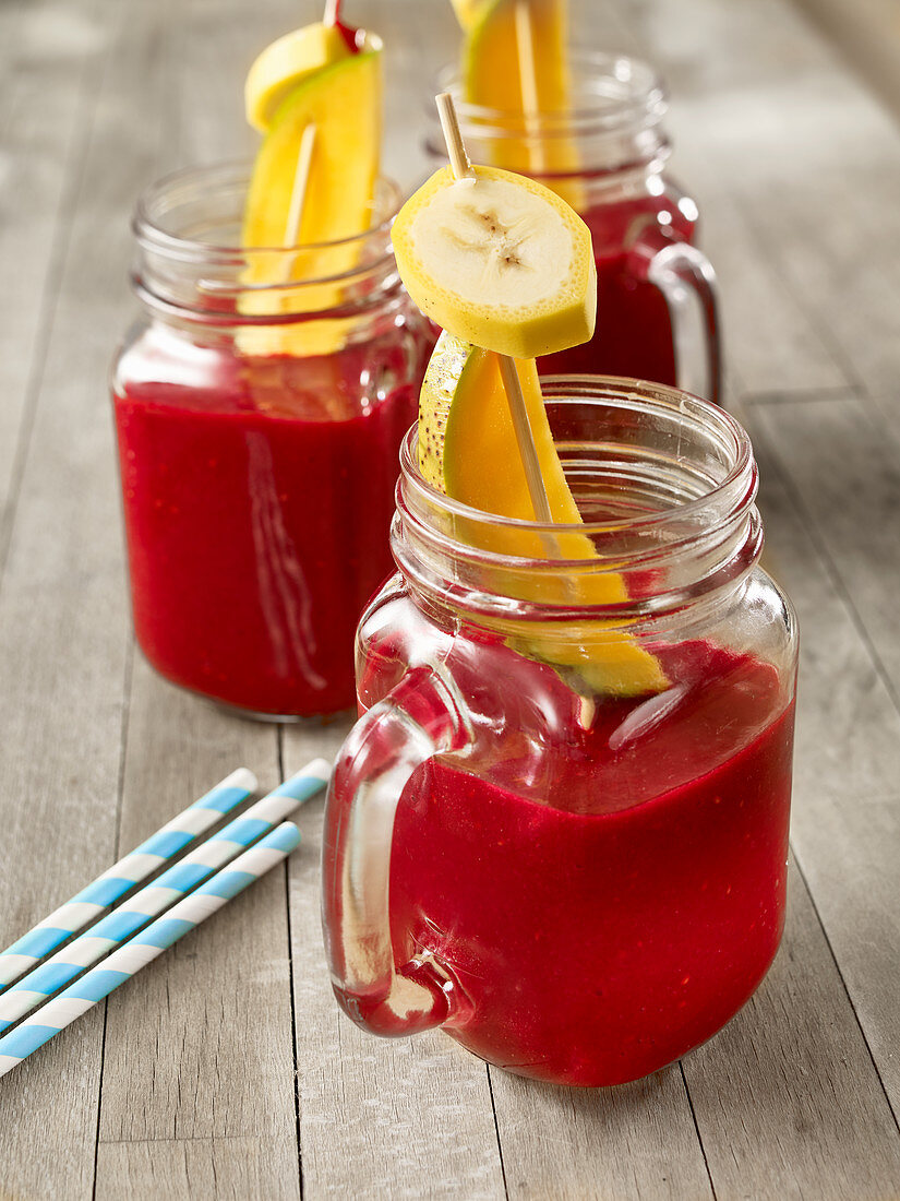 A beetroot smoothie with fruit skewers