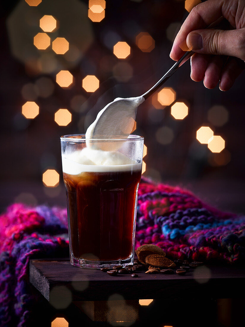 Black coffee with almond liqueur and whipped cream