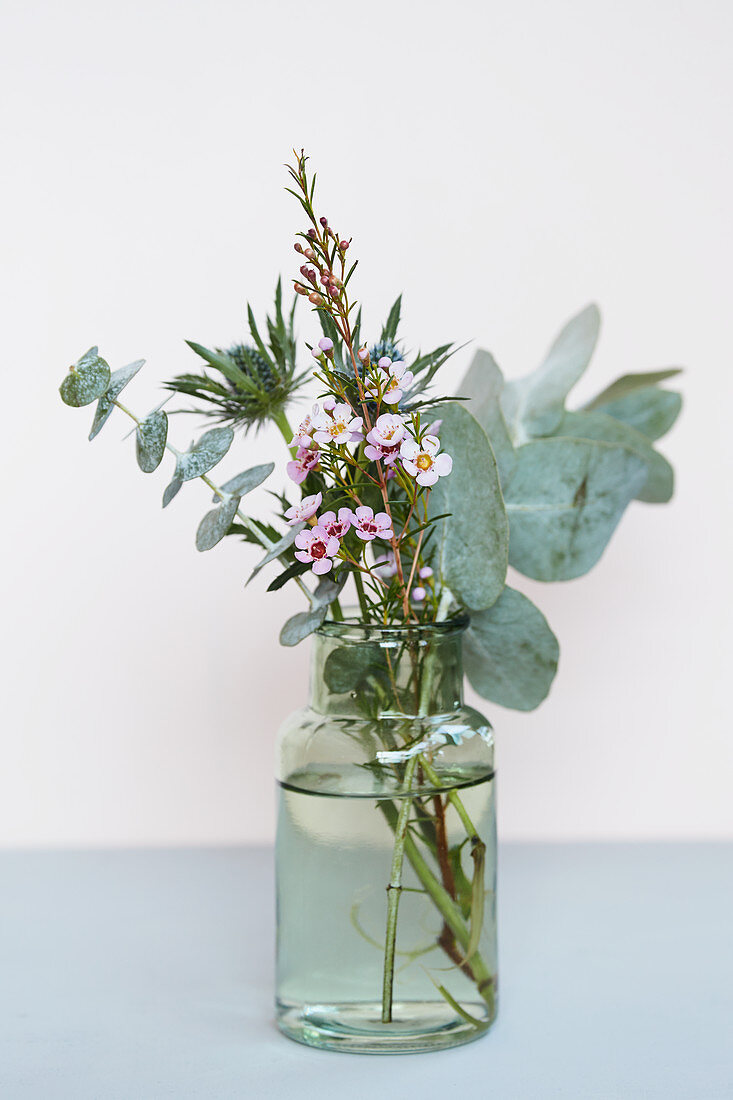 Posy of eucalyptus, sea holly and waxflower