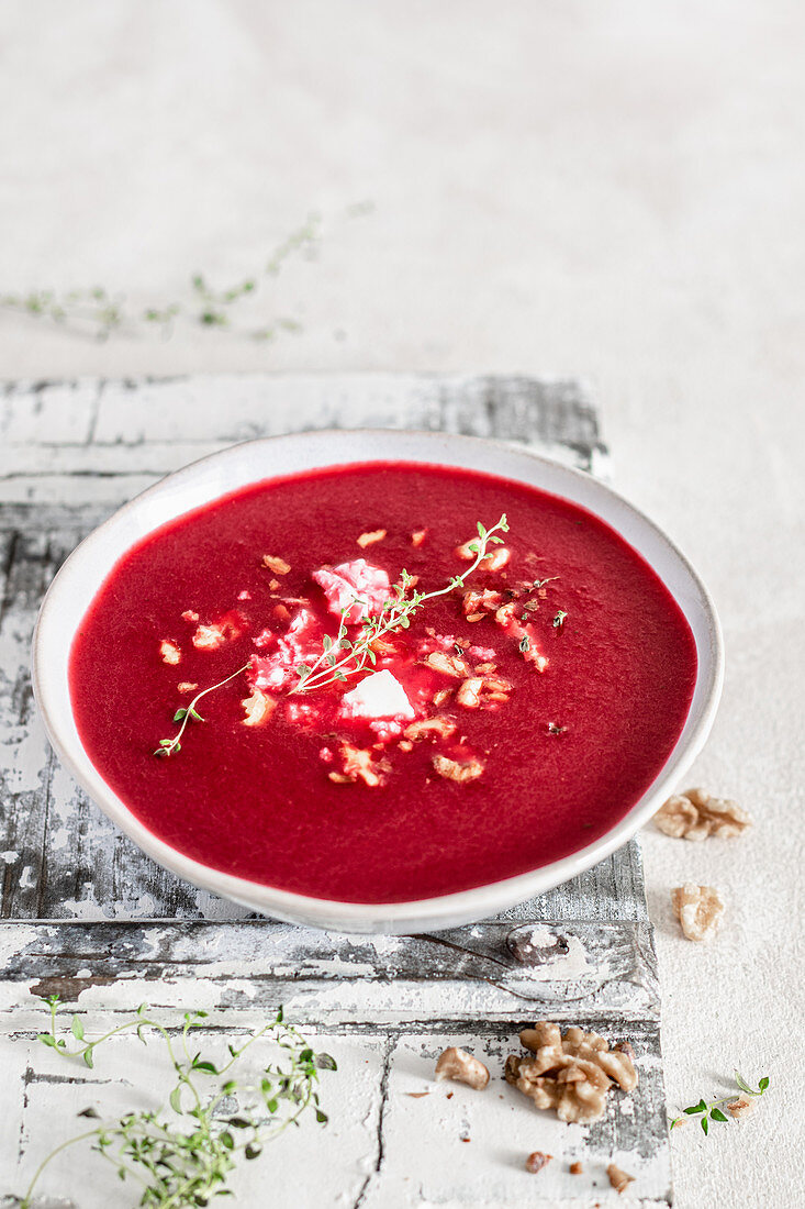 Beetroot cream soup with feta cheese and walnuts