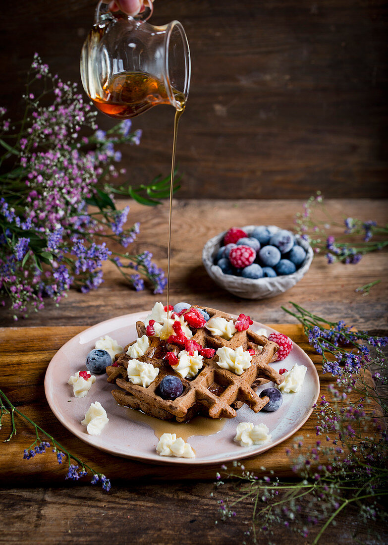 Cocoa waffles with mascarpone fruits and maple syrup