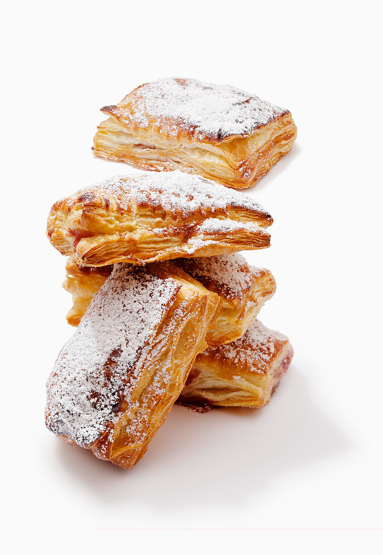 Puff pastry pockets with cherry jam and powdered sugar