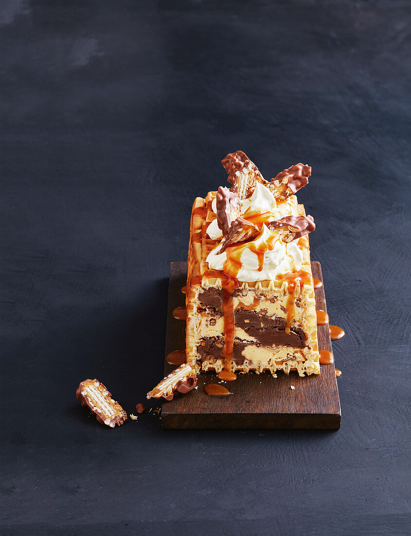 Ice cream cake with waffles and caramel sauce