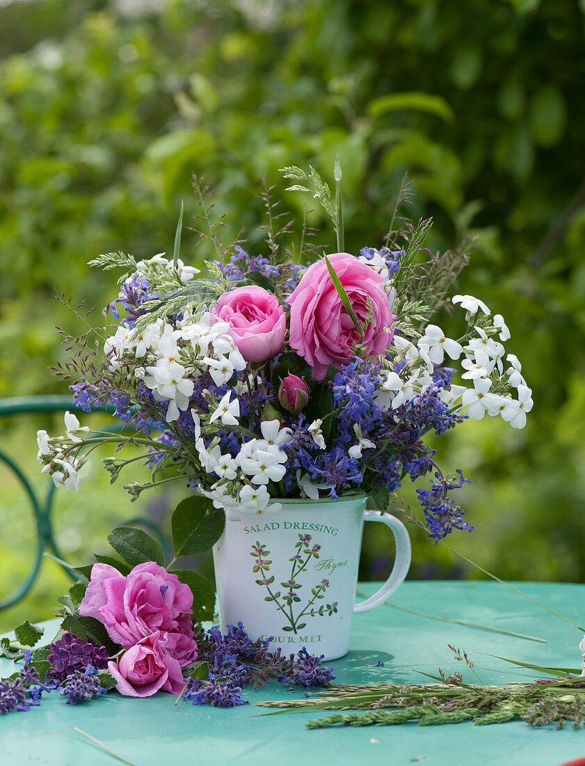 Rural bouquet with roses, catnip, gold lacquer and grass