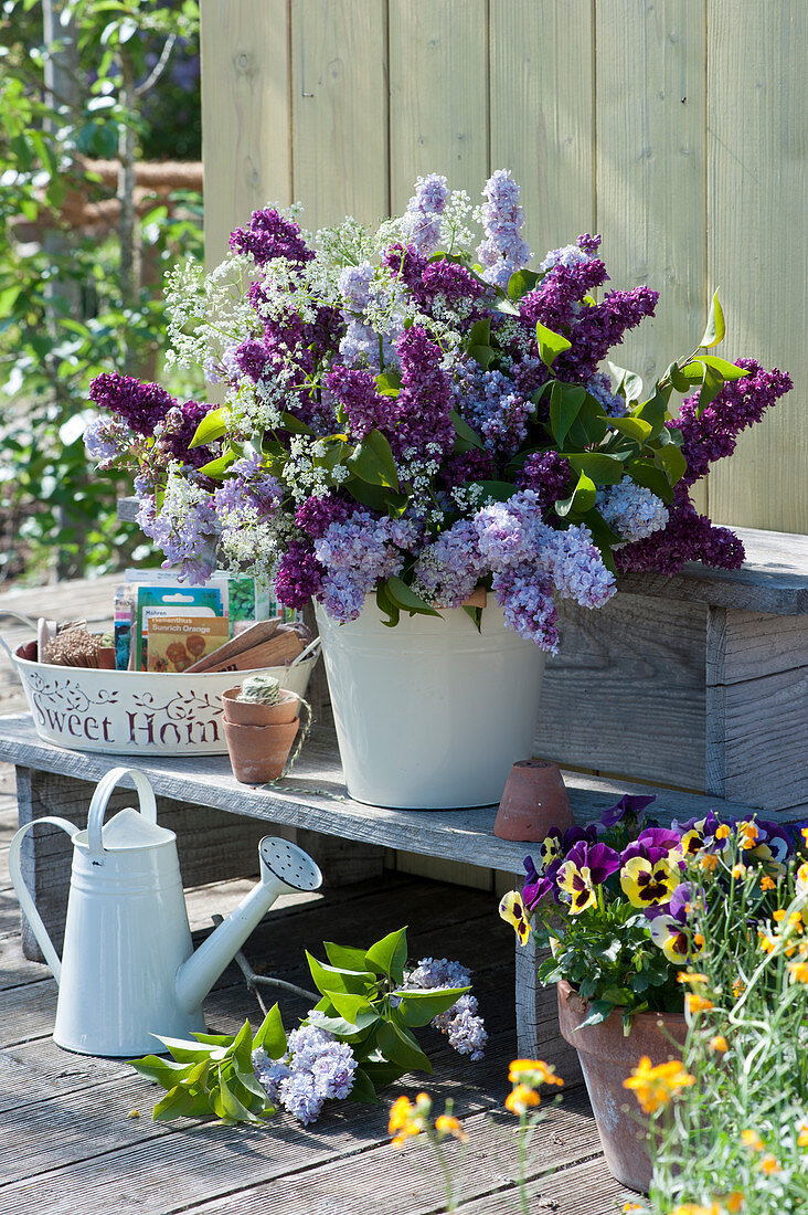 Lush bouquet made of lilac and bibernelle, mixed light and dark