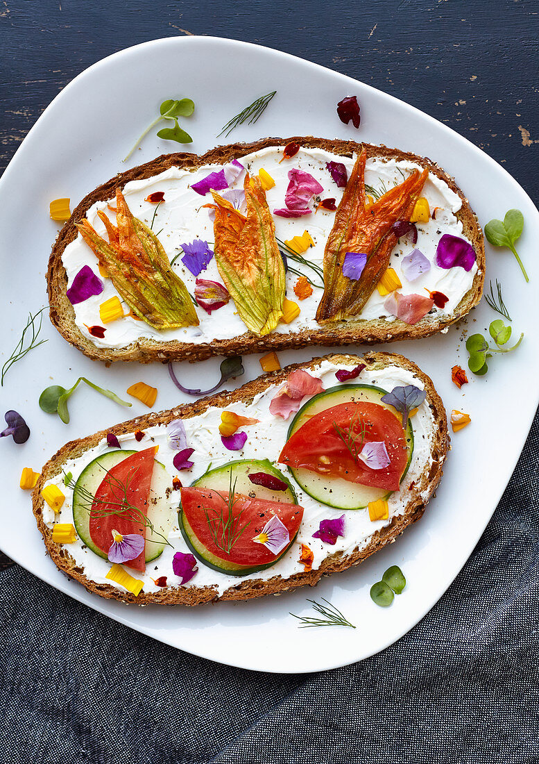 Toast with edible flower enfused cream cheese (sauteed squash blossom, cucumber, tomato, dil)