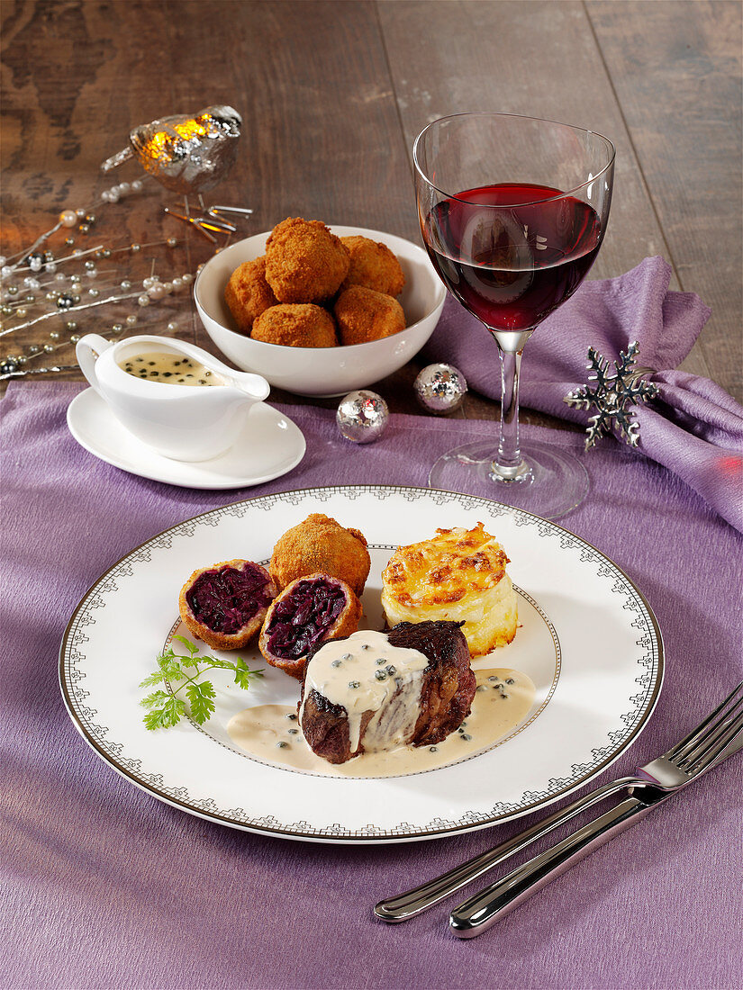 Beef fillet steak with red cabbage dumplings and potato gratin