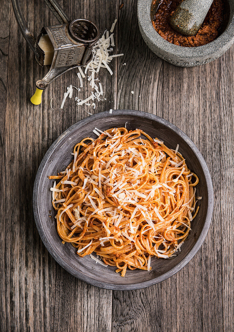 Spaghetti with pesto rosso and parmesan