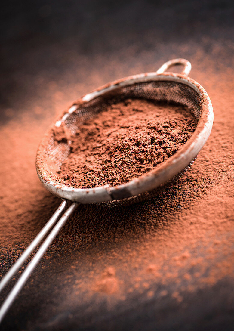 Chocolate powder in a sieve