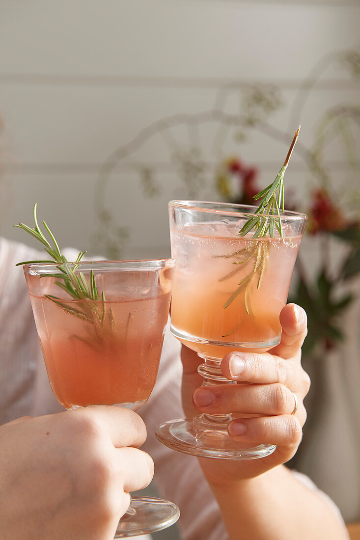 Pink fizz with rosemary sprigs